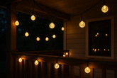 String lights on a wooden deck at night